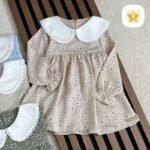 پیراهن دخترانه گل دار یقه ب برند MANELY شیری - نی نی استار